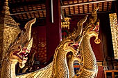 Wat Xieng Thong temple in Luang Prabang, Laos. Detail of flame-like gilded lacquered carvings of sacred serpents or nagas on the Royal Funerary Chariot. 